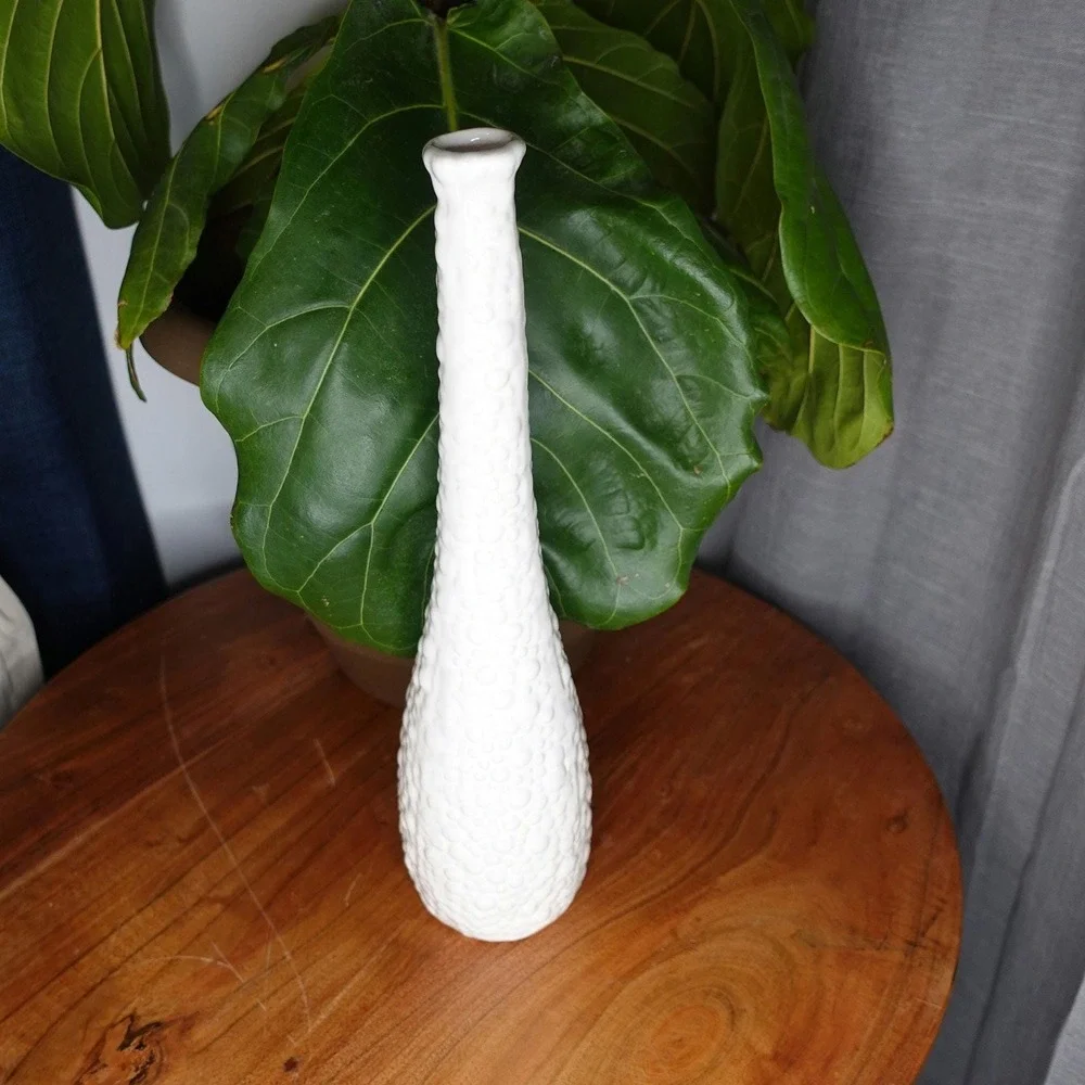 White vase with long neck and‎ gourd like ribbed textured
